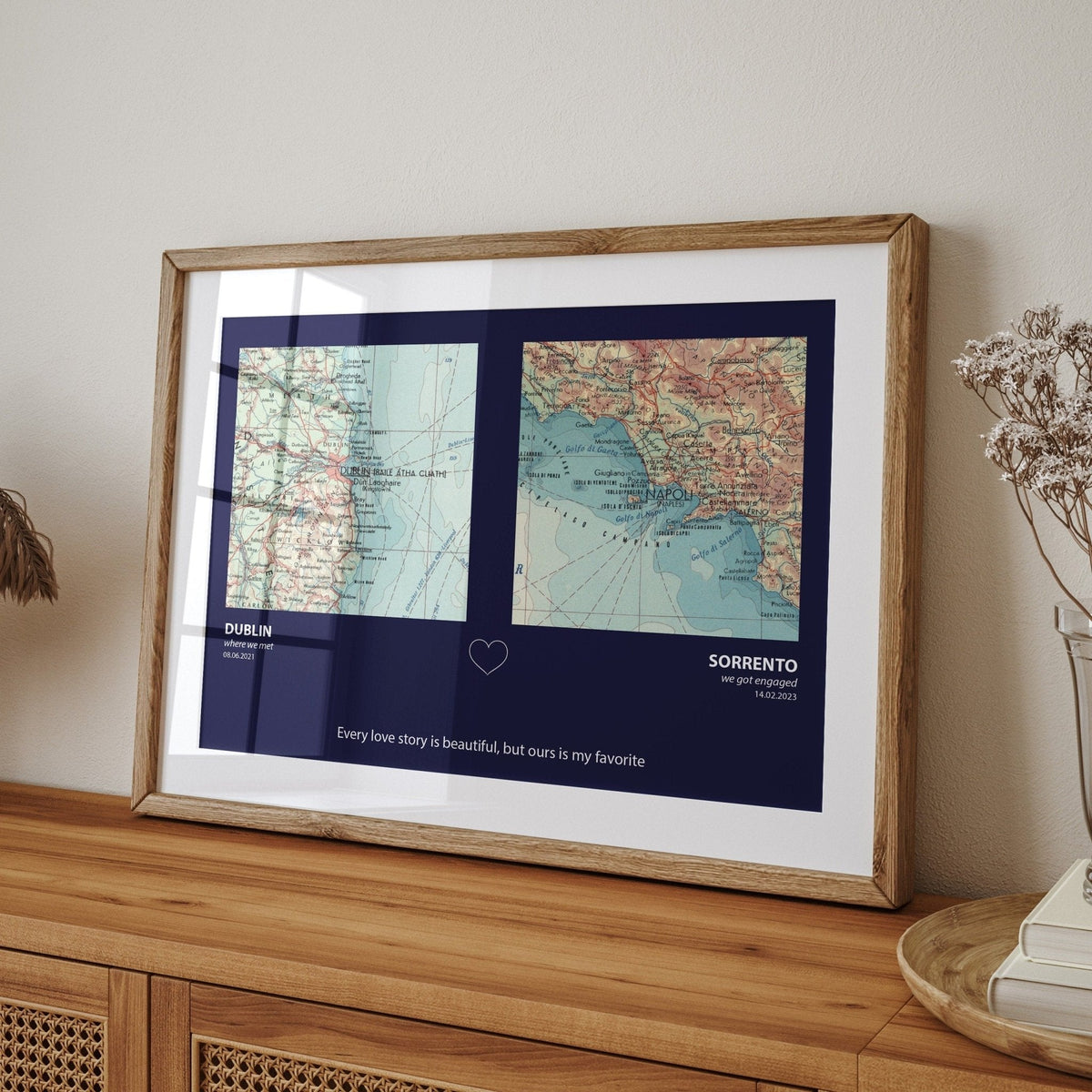 Framed custom map print of two locations, Dublin and Sorrento, on a wooden sideboard