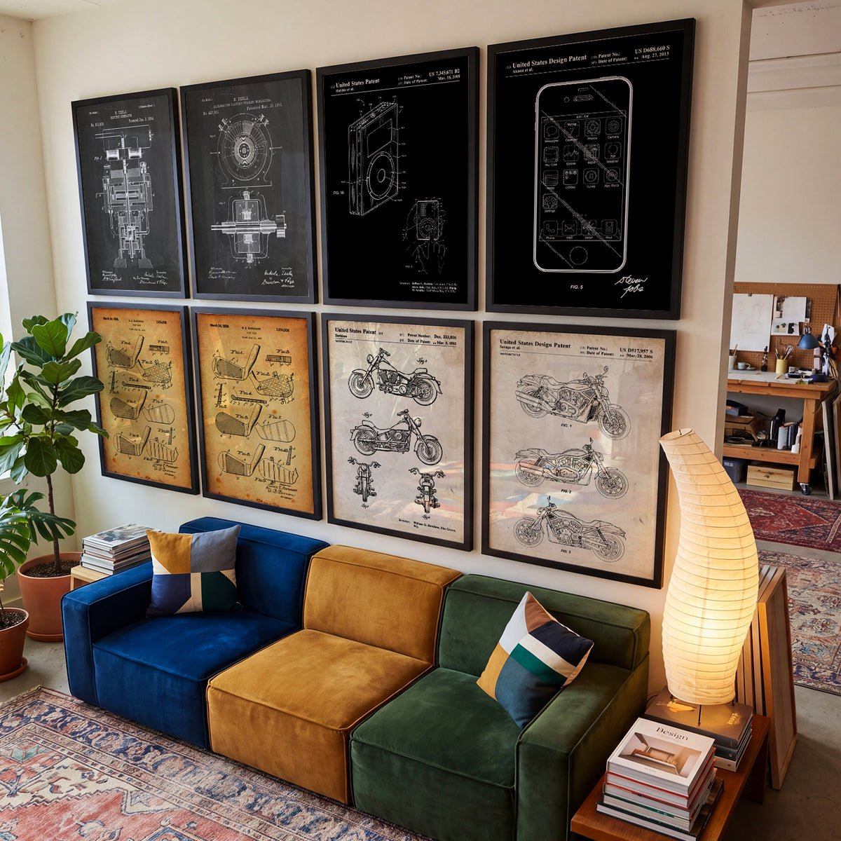 A wall of framed patent prints above a sofa
