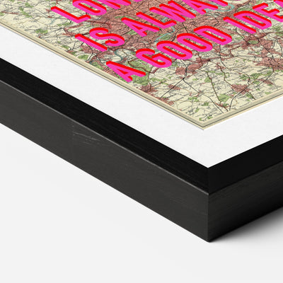 Black premium box frame corner with a white mount around a vintage map print