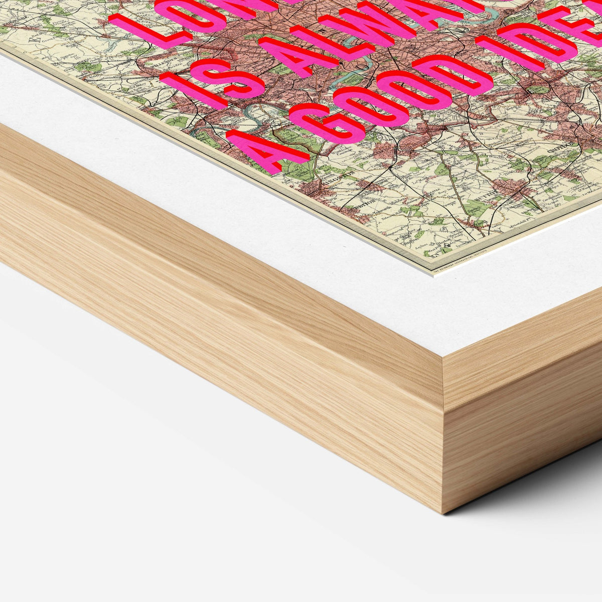 Natural wood premium box frame corner with a white mount around a vintage map print